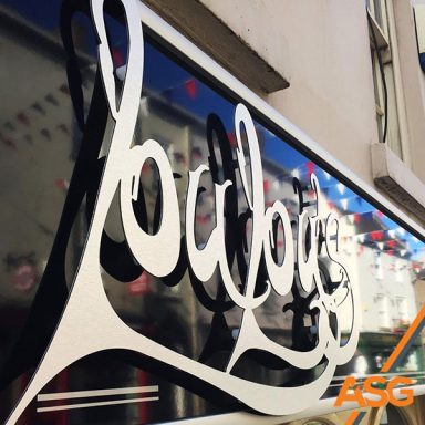 LouLou's signage with silver cut out lettering - installed by Acres Signs and Graphics