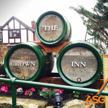 Bespoke cut out lettering mounted onto beer kegs for The Crown Inn by Acres Signs and Graphics