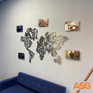 Silver geometric map with mounted photos for internal signage