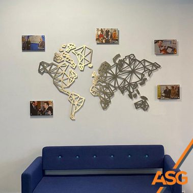 Silver geometric map with mounted photos for internal signage