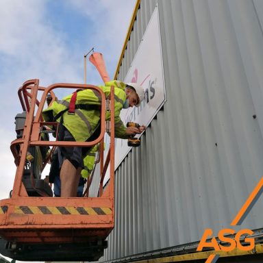 Team installs signage