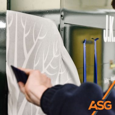 Acres Signs and Graphics team finish off the livery on a van