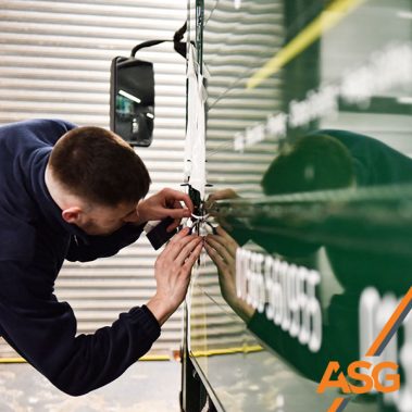 Acres Signs and Graphics team finish off the livery on a van