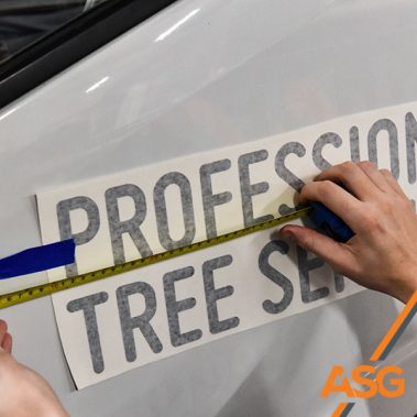 Acres Signs and Graphics team finish off the livery on a van